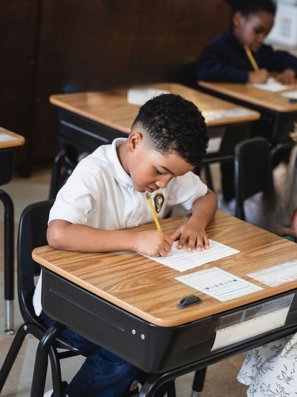 kindergarten boy writing