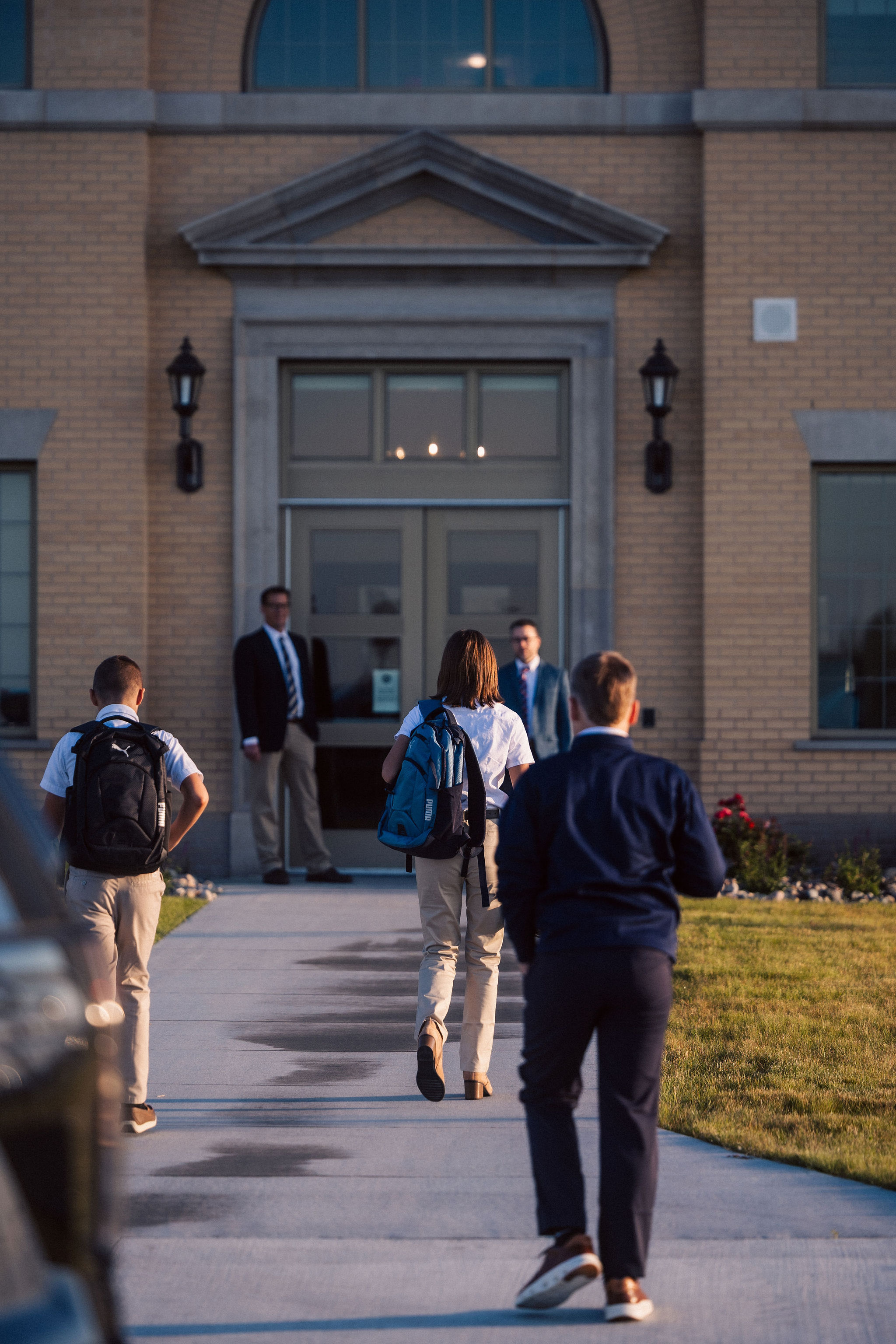 students walking into school