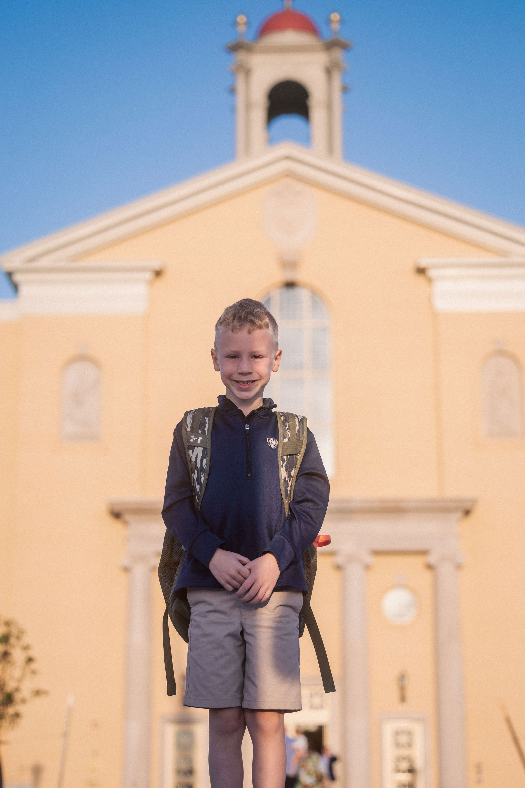 boy in front of school