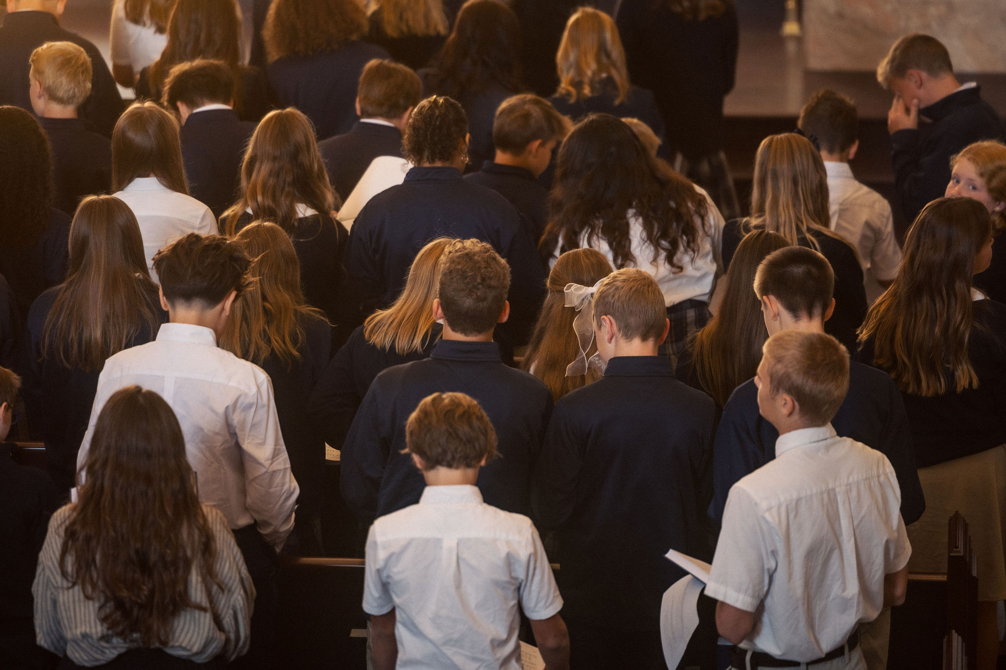 back of students heads in chapel