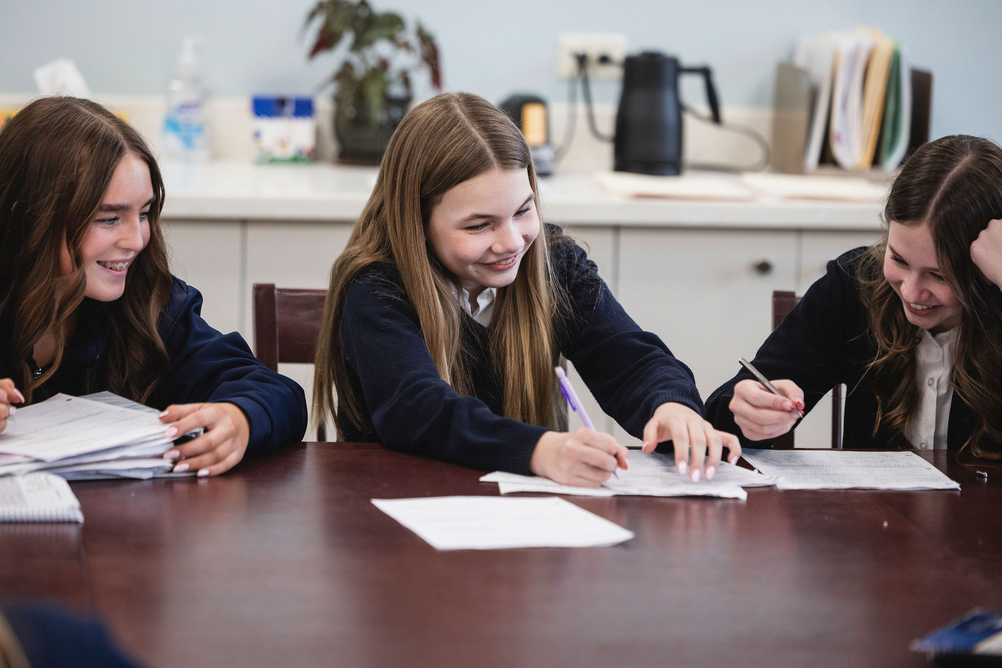 Girls Writing in Notebooks