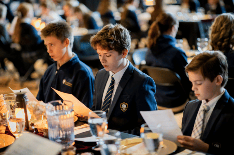 Young Men at Thanksgiving Feast
