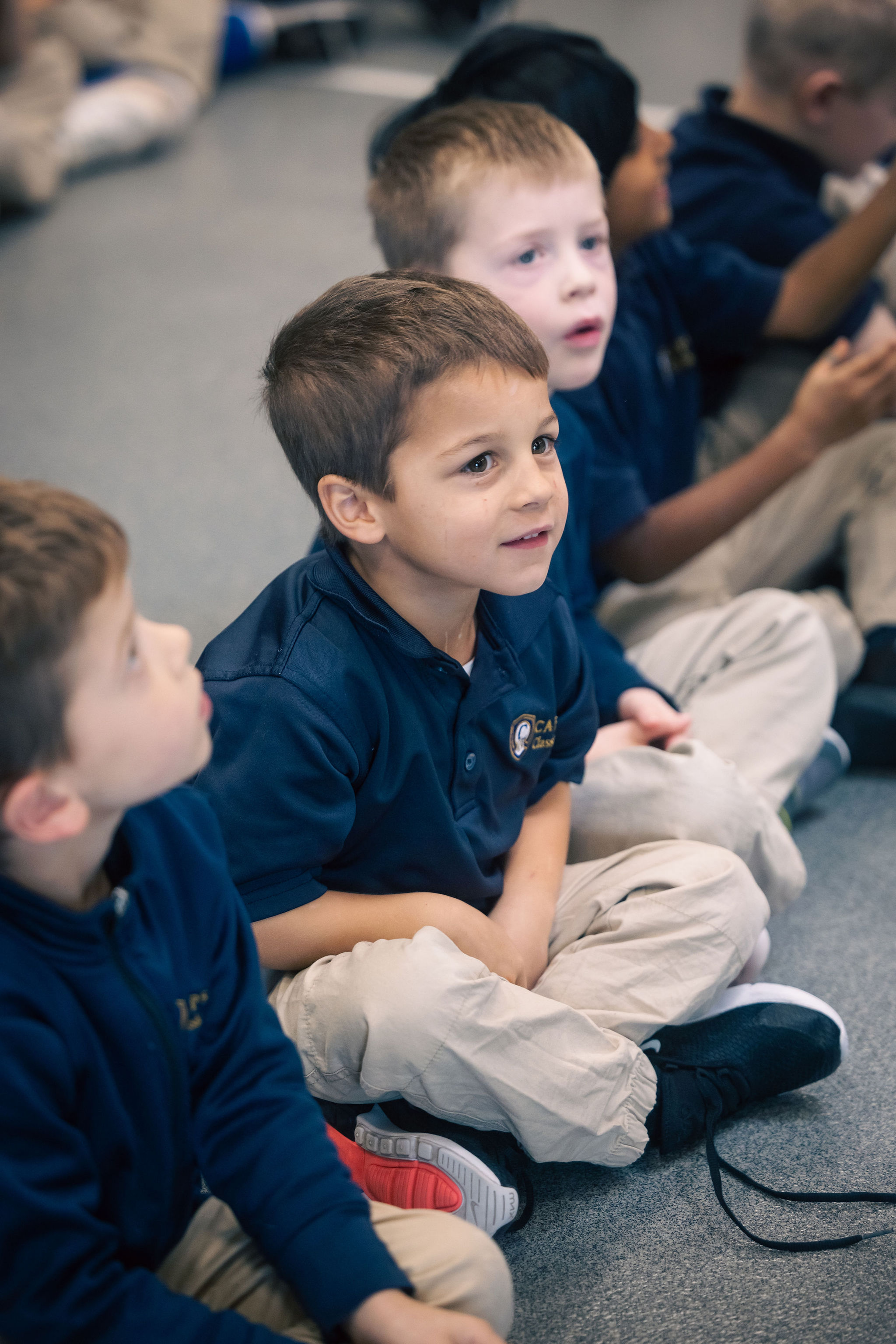 Kindergarten boy looking up