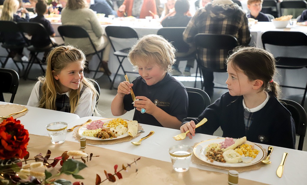 Capstone students enjoying a feast