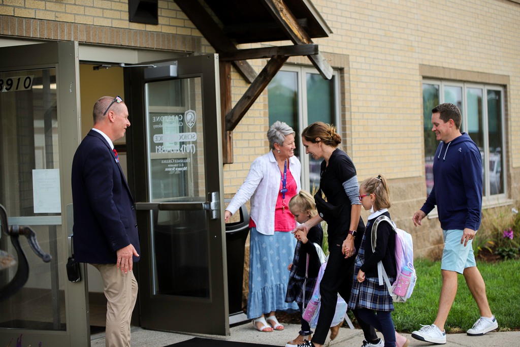 Faculty welcoming students on their first day