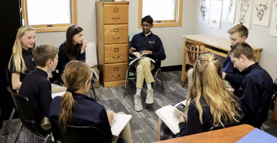 Students reading and discussing in a circle