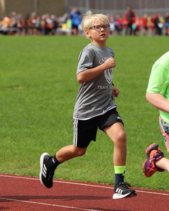 Student running on track