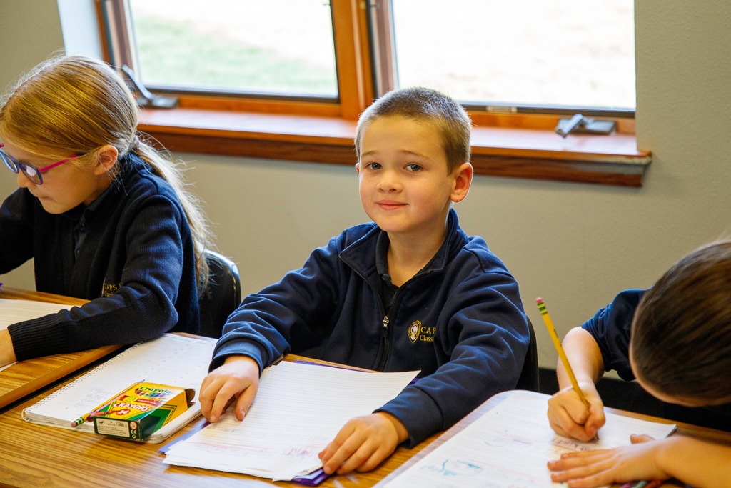 Student smiling at camera