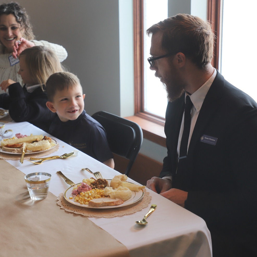 Student smiling at feast