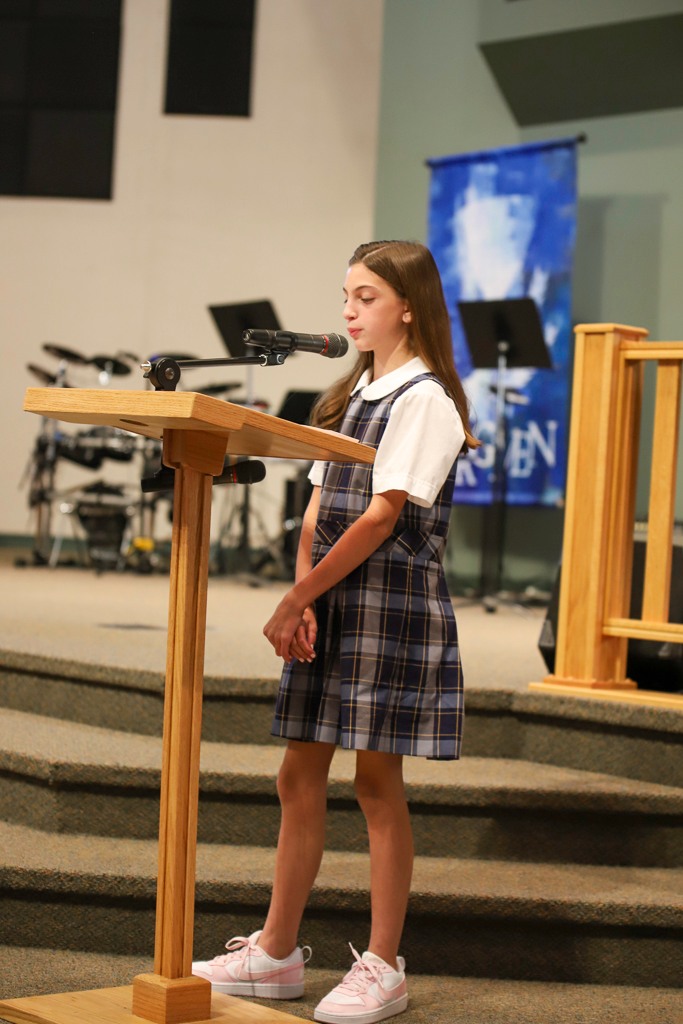 Student speaking at podium