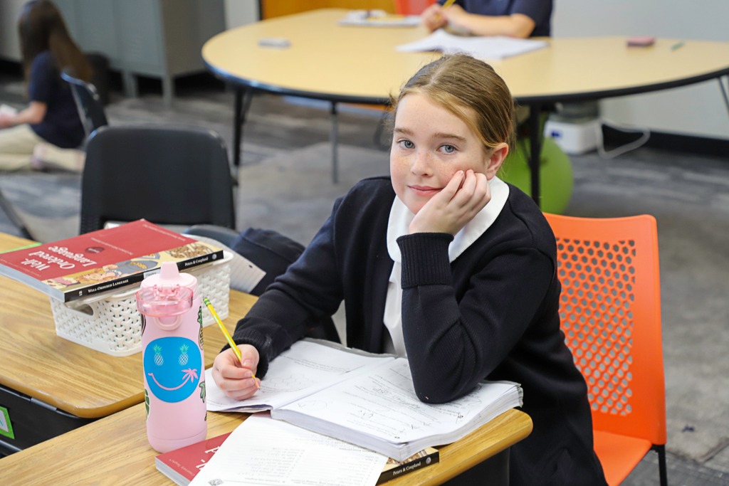 Student staring at camera in thought