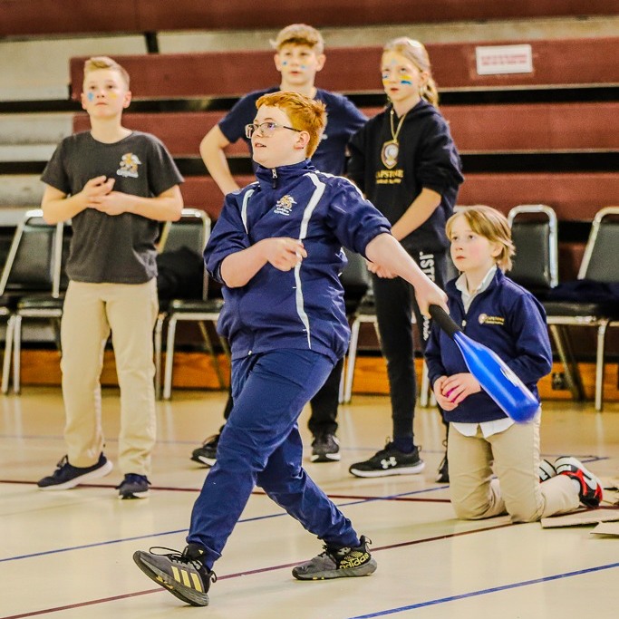 Student swinging bat