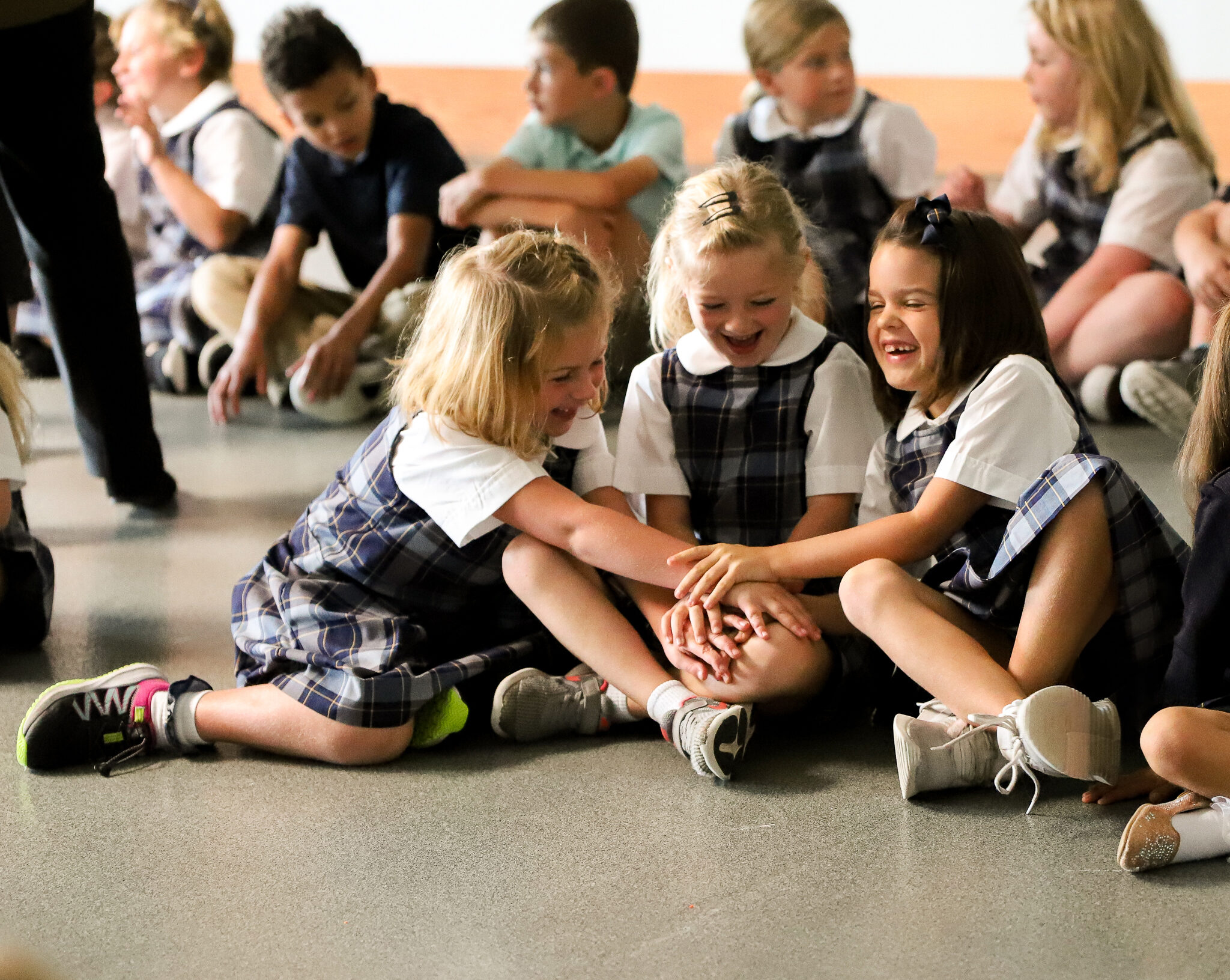 Students laughing and holding hands