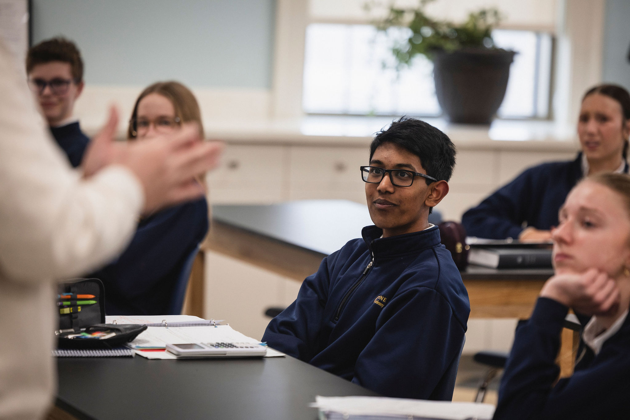 boy listening to teacher